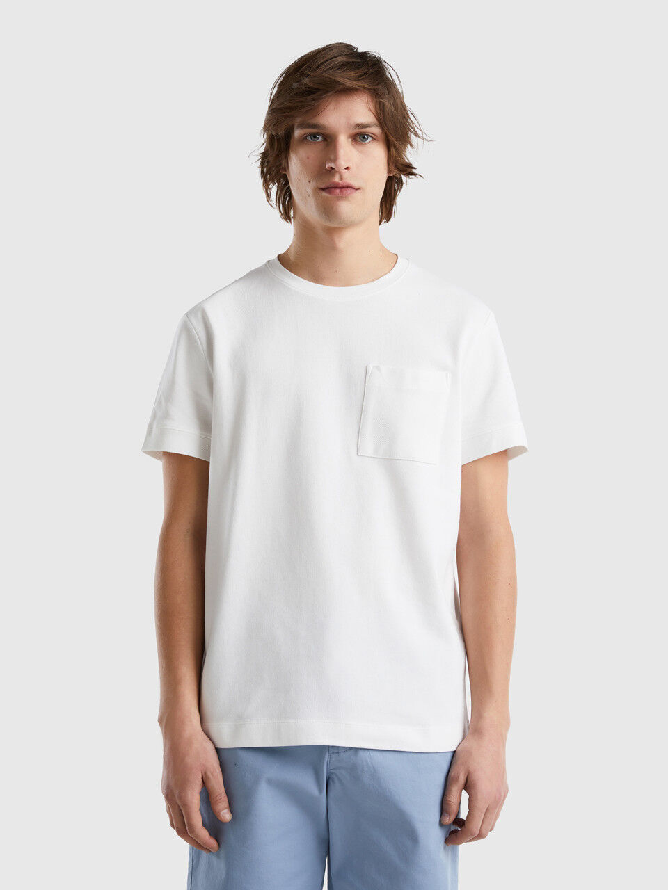 Camiseta de 100 % algodón con bolsillo